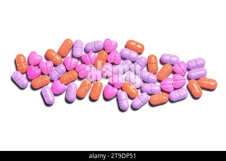 Closeup shot of a pile of colorful vitamin pills on white background. Stock Photo