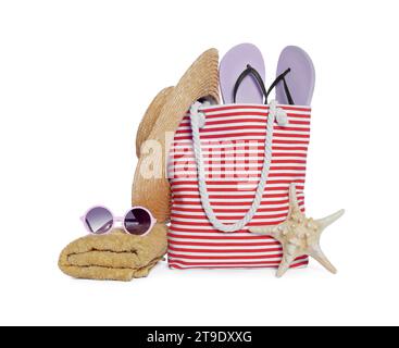 Stylish bag, starfish and other beach accessories isolated on white Stock Photo