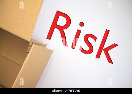 Word Risk Box Risk word with cardboard box. Brown folded card box Stock Photo - Alamy