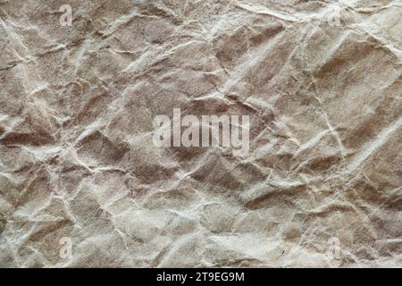 Crumpled craft packaging paper, macro close-up Stock Photo