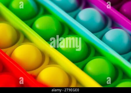 Pop it, convex hemispheres of different colors, close-up macro view Stock Photo