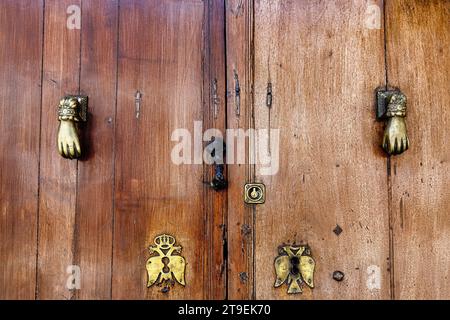 Door knocker, detail of an old wooden door in Ronda, Spain Stock Photo