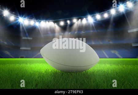 3d rendering rugby ball on field in stadium Stock Photo