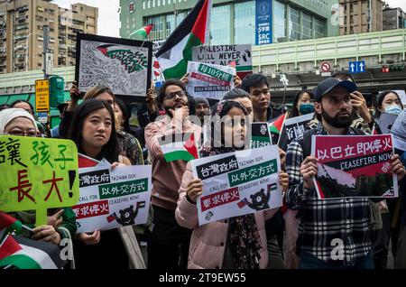 Demonstration Urging Taiwanese Government for Diplomatic Action in Palestinian-Israeli Conflict during a protest in Taipei, Taiwan on 25/11/2023 Protestors call immediate ceasefire and the cessation of Israels illegal occupation and apartheid practices The gathering underscores the urgency for action and the international community's responsibility in the face of the ongoing Palestinian plight. Banners and slogans 'Taiwan Can Help Palestine', Ceasefire Now and Free Palestine reflect solidarity and a call for global accountability. by Wiktor Dabkowski Stock Photo