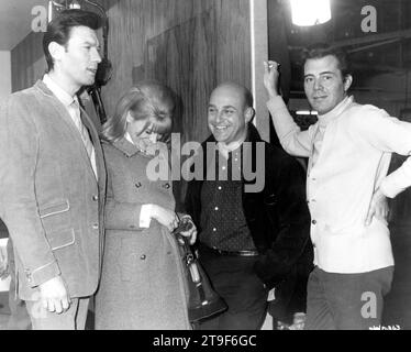 LAURENCE HARVEY JULIE CHRISTIE Director JOHN SCHLESINGER and DIRK BOGARDE on set candid during filming at Shepperton Studios of DARLING 1965 director JOHN SCHLESINGER screenplay Frederic Raphael Joseph Janni Production / Vic Films / Appia Films Ltd. Stock Photo