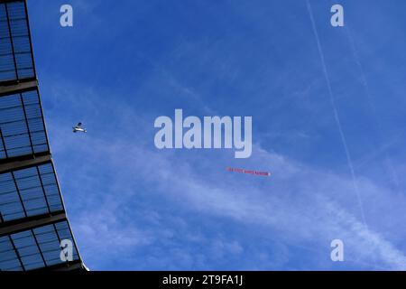 A plane, organised by Amnesty International UK campaigners, carrying a banner reading “UAE: Free Ahmed Mansoor” flies over the Etihad Stadium, home of Manchester City during the Premier League match against Liverpool. Mansoor is a blogger, poet and leading Emirati human rights activist who has been in jail and kept in solitary confinement in the UAE since 2017 as a direct result of his campaigning activity. Picture date: Saturday November 25, 2023. Stock Photo