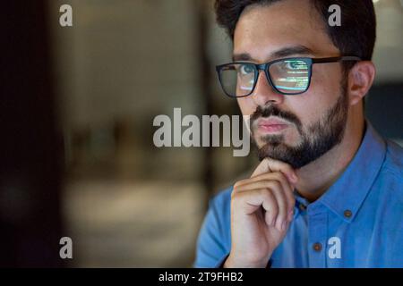 Coder working with ai software development solutions. Code glasses reflections. Stock Photo