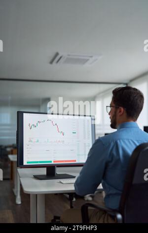 Busy business man broker investor using computer analyzing stock market. Stock Photo