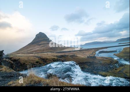 Kirkjufell Mountain (Church Mountain) and Kirkjufellsfoss Waterfall in Iceland Stock Photo