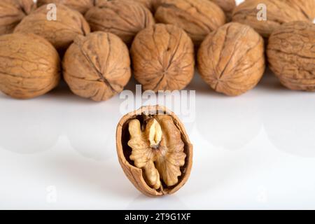 Peeled and shelled walnuts on a white background Stock Photo