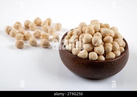 A group of peeled hazelnuts, isolated on a white background Stock Photo