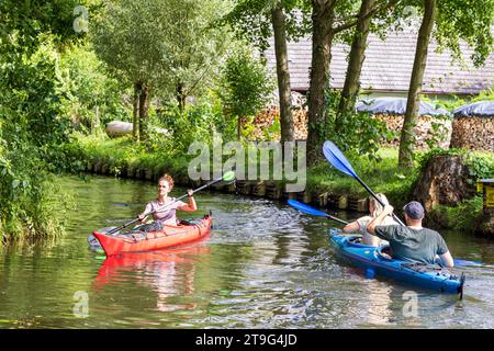 Burg, Germany - July 22, 2023: Canoe trip in Spreewald also called Venice of Germany with lots of canals and water pleasure between Dresden and Berlin in Brandenburg state in Germany Stock Photo