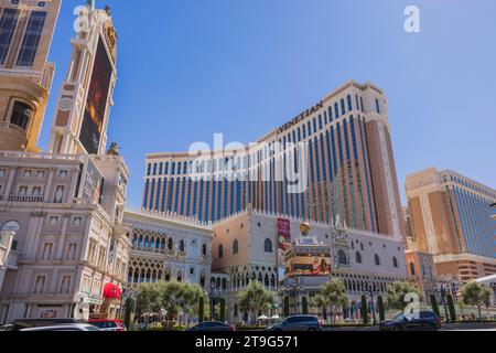 View of famous Las Vegas Strip with cars pass Venetian casino hotel on sunlit day. Las Vegas. USA. Stock Photo