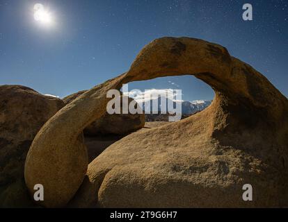 Mobius Arch lit by full moon on clear night, Alabama Hills, California ...