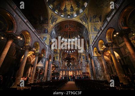 Venice, Italy - November 9 2023: Interior view of St Mark Basilica with golden mosaics covered in Piazza San Marco Stock Photo