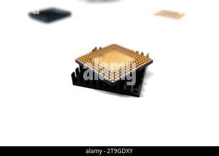 Microprocessor with a heat sink lying on a white surface, isolated on white Stock Photo