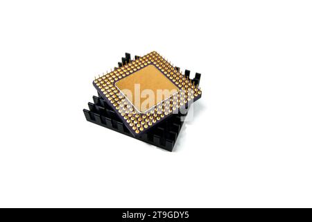 Microprocessor with a heat sink lying on a white surface, isolated on white Stock Photo