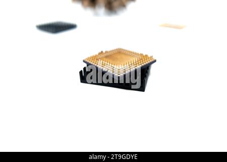 Microprocessor with a heat sink lying on a white surface, isolated on white Stock Photo