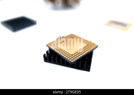 Microprocessor with a heat sink lying on a white surface, isolated on white Stock Photo