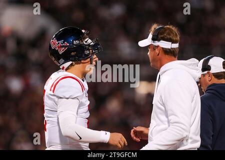 Starkville, Mississippi, USA. 23rd Nov, 2023. 11/23/23 - Starkville, MS - Ole Miss Rebels quarterback JAXSON DART (2) and Rebels head coach LANE KIFFIN talk about plays during the 2023 Egg Bowl at Davis Wade Stadium in Starkville, Mississippi.Zuma Press (Credit Image: © Hunter Cone/ZUMA Press Wire) EDITORIAL USAGE ONLY! Not for Commercial USAGE! Stock Photo
