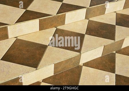 Concrete stairs are decorated with square, rectangular and triangular ceramic tiles Stock Photo