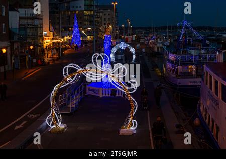 Poole, Dorset UK. 25th November 2022. Poole Christmas Maritime Light Festival launches today at Poole, Dorset, as crowds flock to see the illuminations and thousands of lights on display around the nautical trail, a free event for the whole family from today until 2nd January. There was some doubt  earlier whether the event would go ahead due to the challenges being faced by BCP Council over the budget with other events being cancelled or scaled back. Credit: Carolyn Jenkins/Alamy Live News Stock Photo