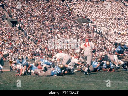 LOS ANGELES, CA - OCTOBER 6:  Players from the Ohio State Buckeyes and UCLA Bruins pile up during an NCAA game on October 6, 1962 at the Los Angeles Memorial Coliseum in Los Angeles, California.  (Photo by Hy Peskin) Stock Photo