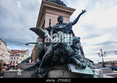 Venice, Italy - November 9 2023: Bronze roaring winged lion, Venice city symbol, Detail of The Queen of Adriatic Plaza Statue Stock Photo