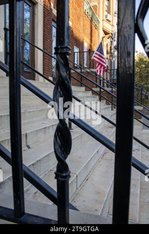 entrance church from a fence behind, highlighting the stairs and the usa flag. Stock Photo