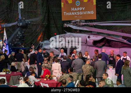 Norfork, United States of America. 19 November, 1901. Left to right: U.S. President Joe Biden, chef Robert Irvine and First Lady Jill Biden serve Thanksgiving meals to members of the armed forces and their families during a Friendsgiving dinner at Naval Station Norfolk, November 19, 2023 in Washington, D.C. The meal was hosted by celebrity chef Robert Irvine Credit: MC2 Anderson Branch/US Navy Photo/Alamy Live News Stock Photo