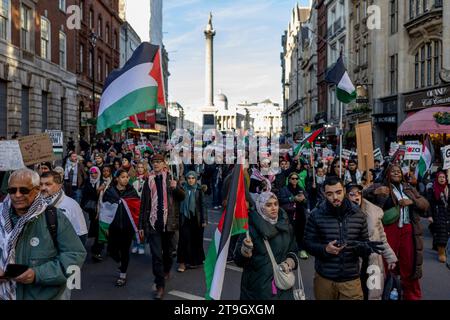 London, UK. 25th Nov, 2023. Pro-Palestinian supporters seen marching with Palestinian flags at Trafalgar Square during the demonstration. Pro-Palestinian supporters continue marching in Central London to demand a permeant ceasefire of Israel-Gaza War since the war out-broke in early October. (Photo by Hesther Ng/SOPA Images/Sipa USA) Credit: Sipa USA/Alamy Live News Stock Photo