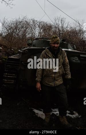 Chasiv Yar, Donetsk Oblast, Ukraine. 25th Nov, 2023. A soldier poses in front of his BMP. The city of Chasiv Yar continues to come under heavy fire from Russian positions outside the city. (Credit Image: © Madeleine Kelly/ZUMA Press Wire) EDITORIAL USAGE ONLY! Not for Commercial USAGE! Stock Photo