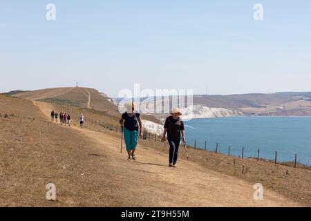 Hikers walking along Tennyson Down on the Isle of Wight Stock Photo