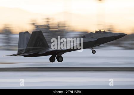 Anchorage, United States. 21 November, 2023. A U.S. Air Force F-22 Raptor fighter aircraft assigned to the 3rd Wing conducts flight operations off a snow cover field at Joint Base Elmendorf-Richardson, November 21, 2023 in Anchorage, Alaska.  Credit: Alejandro Pena/Planetpix/Alamy Live News Stock Photo