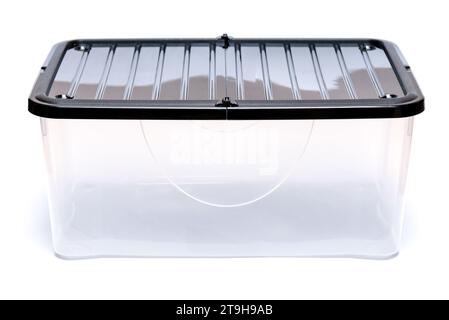 Empty plastic storage box isolated on white background. Plastic transparent container with lid for moving items. Stock Photo