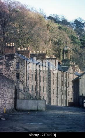 1977 archive photograph of New Lanark Mill World Heritage Site in South Lanarkshire, Scotland.  Founded in 1785 by David Dale in partnership with Richard Arkwright, it bacame a successful business during a period of partnership with Robert Owen and only finally closed in 1968.  The Utopian principles of the early development as a planned settlement have made it an important location in the historical development of urban planning.  It is now managed by the New Lanark Trust and the mills and village have been restored as a tourist attraction. Stock Photo