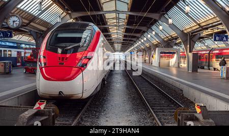 Zurich, Switzerland - November 23, 2023: Anamorphic photo of modern train staying at Zurich railway station Stock Photo