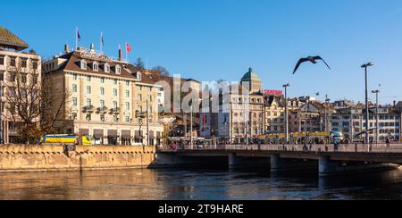 Zurich, Switzerland - November 23, 2023: Anamorphic photo of the river Limmat and cityscape of Zurich with Bahnhof bridge Stock Photo