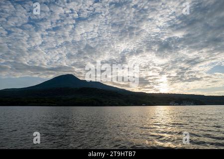 Dark Coastline Seen From Afar with Volcanic Mountain Ranges with Lush Vegetation Forests and Beaches in Front of a Calm Ocean near La Union, El Salvad Stock Photo