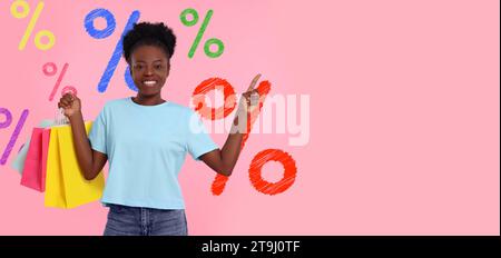 Discount offer, banner design. Happy woman with paper shopping bags pointing at something on pink background, space for text. Drawn percent signs behi Stock Photo