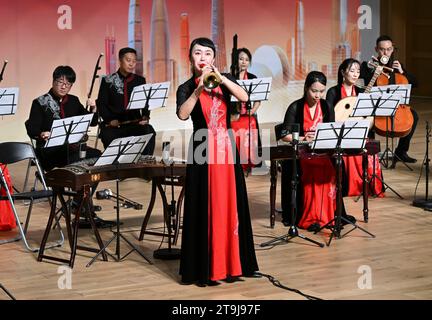 (231126) -- SELANGOR, Nov. 26, 2023 (Xinhua) -- Artists perform at the Canton Rhythms for Silk Road concert at the Xiamen University Malaysia (XMUM) in Selangor state, Malaysia, Nov. 24, 2023. The Canton Rhythms for Silk Road concert was held at the XMUM on Friday evening. The concert, consisting of renowned compositions such as A Hundred Birds Worshipping the Phoenix, Rain Hitting Banana Trees, and Step by Step High, as well as the traditional Malaysian folk music Rasa Sayang with traditional Chinese musical instruments, drew loud applause from the audience. Outside the concert hall, an exh Stock Photo