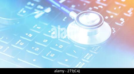 Medical stethoscope closeup on a computer keyboard Stock Photo
