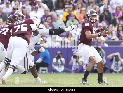 Baton Rouge, USA. 25th Nov, 2023. LSU Tigers defensive tackle Maason Smith (0) reaches past Texas A&M Aggies offensive lineman Kam Dewberry (75) while trying to get to Texas A&M Aggies quarterback Jaylen Henderson (16) during a Southeastern Conference football game at Tiger Stadium in Baton Rouge, Louisiana on Saturday, November 25, 2023. (Photo by Peter G. Forest/Sipa USA) Credit: Sipa USA/Alamy Live News Stock Photo