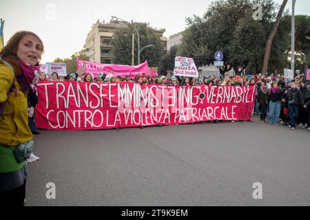 Rome, Italy. 25th Nov, 2023. The march behind the banner with the writing ''ungovernable transfeminists against patriarchal violence'' on the occasion of the demonstration organized by Non Una di Meno in Rome. 'At least 500 thousand'' people, according to the organizers' estimates, took part in the demonstration promoted by Non una di meno, the feminist and transfeminist movement, on the occasion of the International Day for the Elimination of Violence against Women in Rome.For now, in Italy in 2023, were recorded 106 murders with female victims, of which 87 were killed in the family/emo Stock Photo