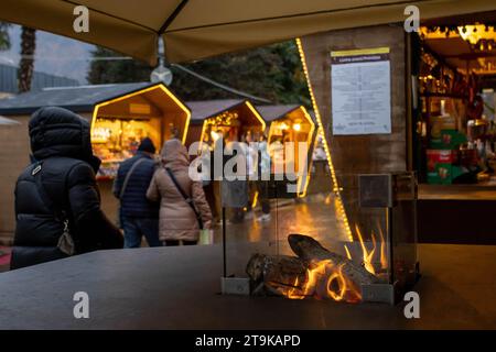 Meran, South Tyrol, Italy 02 December 2022 People shopping and eating at market stalls Stock Photo
