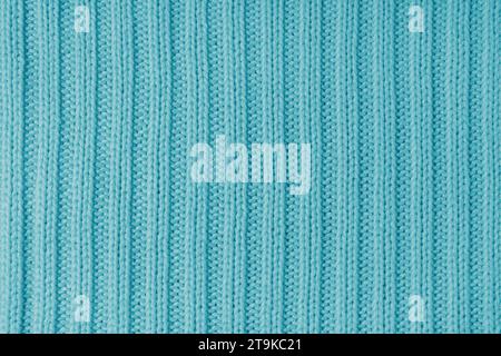 Jersey textile background , turquoise striped knitted fabric. Woolen knitwear, sweater, pullover surface texture,  textile structure, cloth surface, w Stock Photo