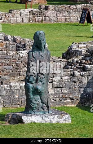 St Cuthbert's statue Lindisfarne Priory, The Holy Island of Lindisfarne, Northumberland, UK Stock Photo