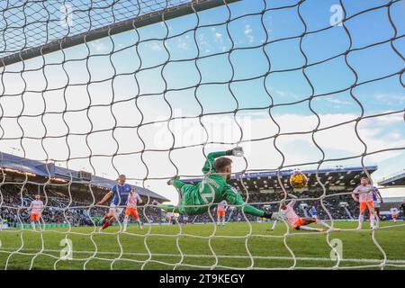 Portsmouth, UK. 25th Nov, 2023. Blackpool goalkeeper Daniel Grimshaw (32) saves during the Portsmouth FC v Blackpool FC sky bet EFL League One match at Fratton Park, Portsmouth, England, United Kingdom on 25 November 2023 Credit: Every Second Media/Alamy Live News Stock Photo