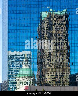 Reflections of Old Courthouse and modern office skyscraper in a mirrored building in downtown St Louis in Missouri Stock Photo