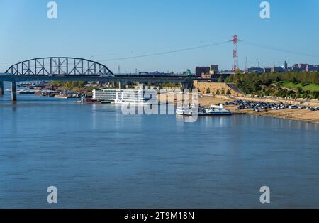 St Louis, MO - 21 October 2023: Viking Mississippi river cruise boat docked on riverbank levee with low water levels in river seen from Eads Bridge Stock Photo